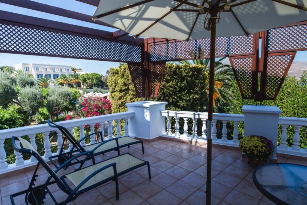 A shaded terrace overlooking the sea at Crithoni’s Paradise Hotel